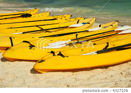 图库照片: kayaks on the beach sand