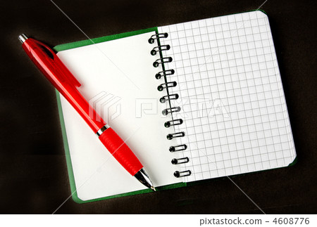 notebook 卡通,notebook卡通 图库照片: opened notebook squared pagewith red pen over it on