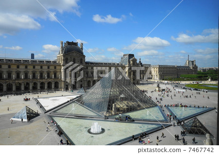 stock photo: the louvre and glass pyramids