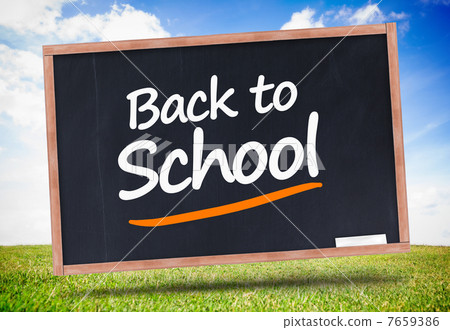 图库照片: back to school written on blackboard