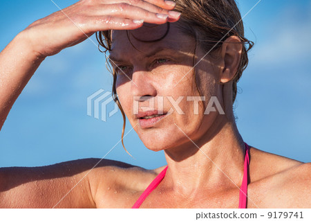 图库照片: woman in a hot sunny day