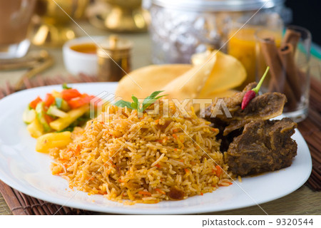 sliced mutton,sliced 图库照片: biryani basmati mutton rice with traditional items on