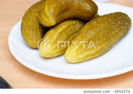 stock photo: dill pickle on plate, pickles