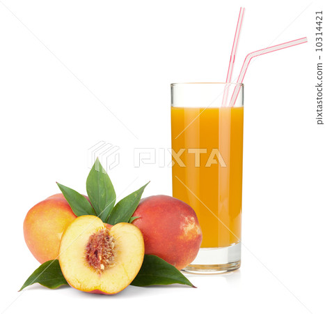 peach juice in a glass and fresh peaches