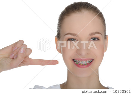 smiling happy girl indicates braces on teeth