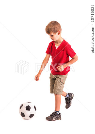 图库照片: cute boy is holding a football ball. soccer ball