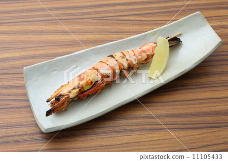 grilling on skewer, shrimps, spit-roasting