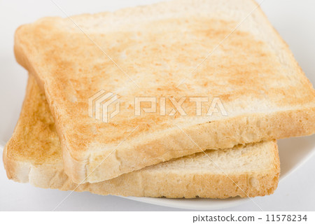 照片素材(图片): simple toast - toasted sliced bread on a white