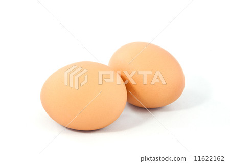 图库照片: two brown eggs isolated on white background