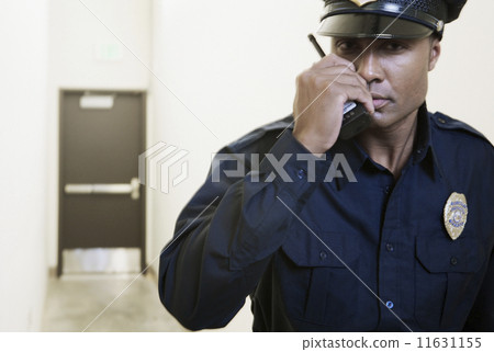 security guard using a walkie-talkie