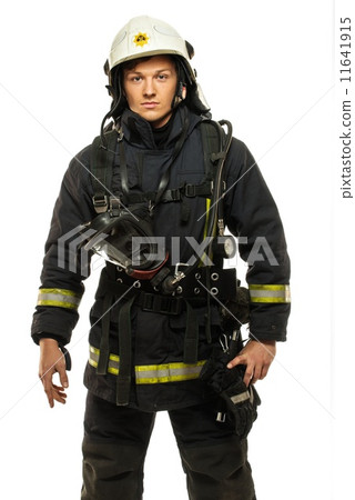 young firefighter wearing helmet isolated on white