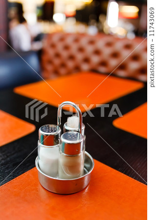 图库照片: pepper and salt shaker on table at restaurant