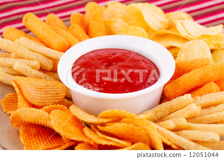 图库照片: potato, corn chips and red sauce