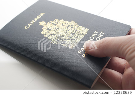 图库照片 handing canadian passport