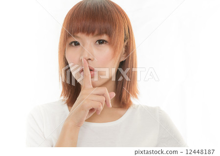 图库照片: asian woman making a keep quiet gesture , isolated on