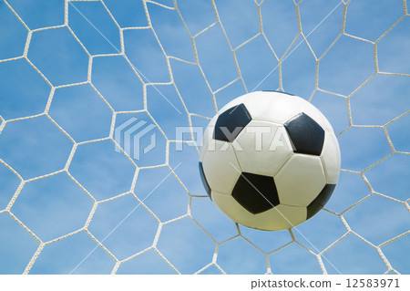 图库照片 soccer ball in the goal after shooted