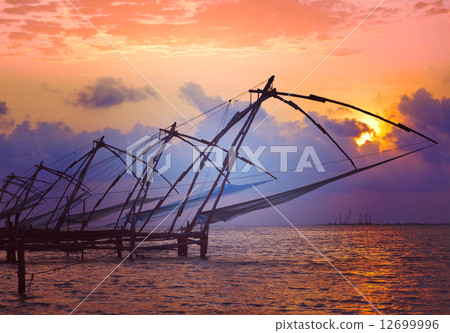 图库照片: chinese fishnets on sunset. kochi, kerala, india