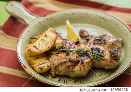 图库照片: grilled chicken plate in a restaurant