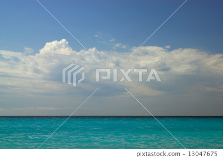 图库照片: blue sky with clouds over azure sea