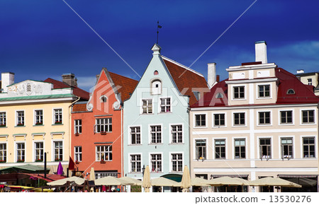 bright multicolor houses on the town hall square.