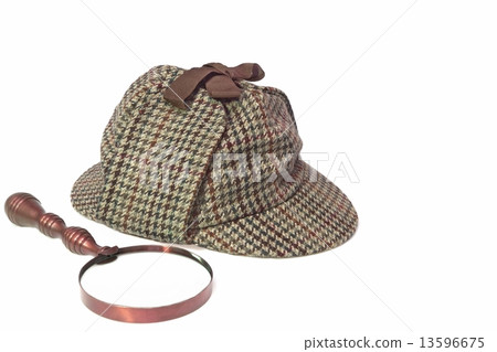 图库照片: deerstalker hat and retro magnifying glass