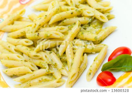 图库照片: italian pasta penne with pesto.