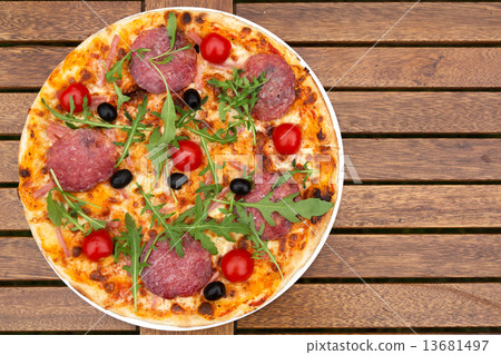 图库照片: delicious italian pizza served on wooden table