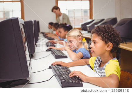 图库照片: cute pupils in computer class with teacher