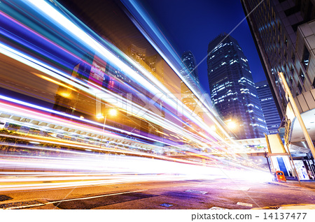 图库照片: traffic light trails in modern city at night