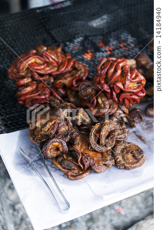 图库照片: stuffed roast pork,pork sausage grilled