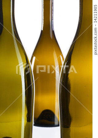 图库照片: detail of three empty wine bottles