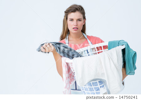 图库照片: hipster woman holding laundry basket