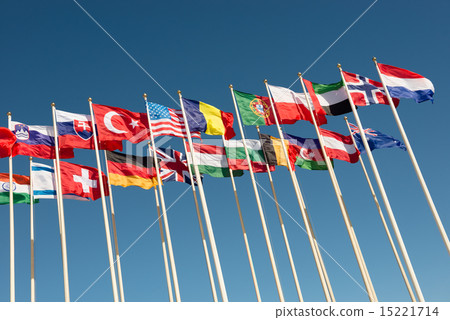 图库照片: flags on flagpoles fluttering in the wind