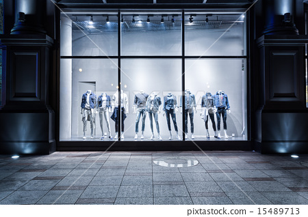 图库照片: fashion shop display window and clothes.