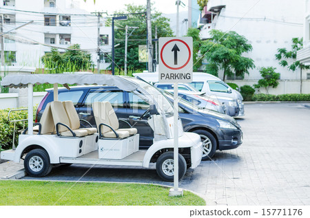 图库照片: cars on a parking lot and parking sign