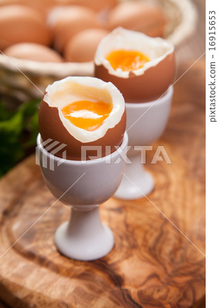 图库照片: boiled eggs on a wooden background