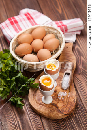 图库照片: boiled eggs on a wooden background