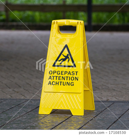 图库照片: watch your step sign on the floor