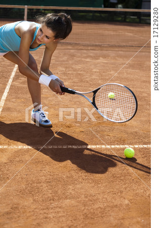 图库照片: girl playing tennis, summertime saturated theme