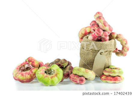 图库照片: manila tamarind fruit in empty burlap sack