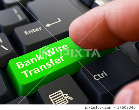 图库插图: pressing green button bank wire transfer on black