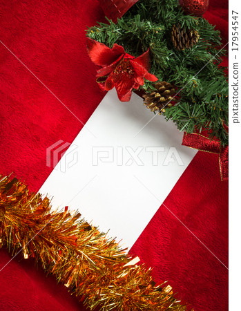 图库照片: christmas card with white paper on red
