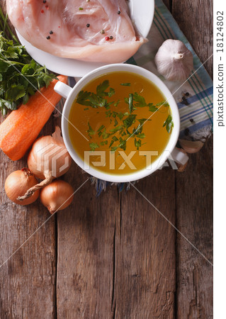 图库照片: chicken broth and ingredients. vertical top view