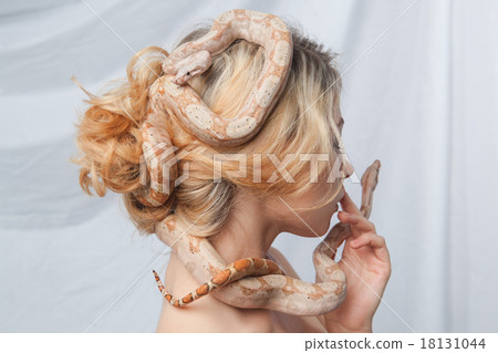 图库照片: beautiful girl and the snake boa constrictors