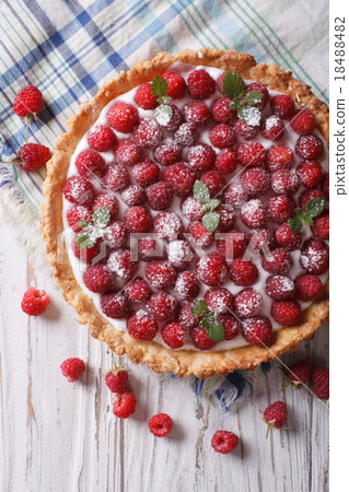 图库照片: fresh raspberry tart with cream cheese top view