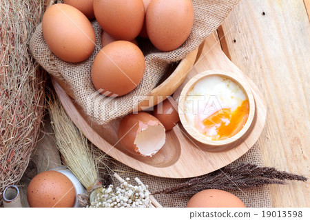 图库照片: soft-boiled egg and eggs on wood background