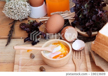 图库照片: soft-boiled egg and eggs on wood background