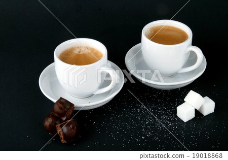 图库照片: two cups of coffee on a black background