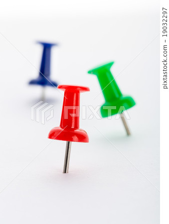 图库照片: push-pins close-up isolated on white background