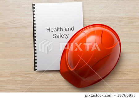 图库照片: health and safety register with helmet